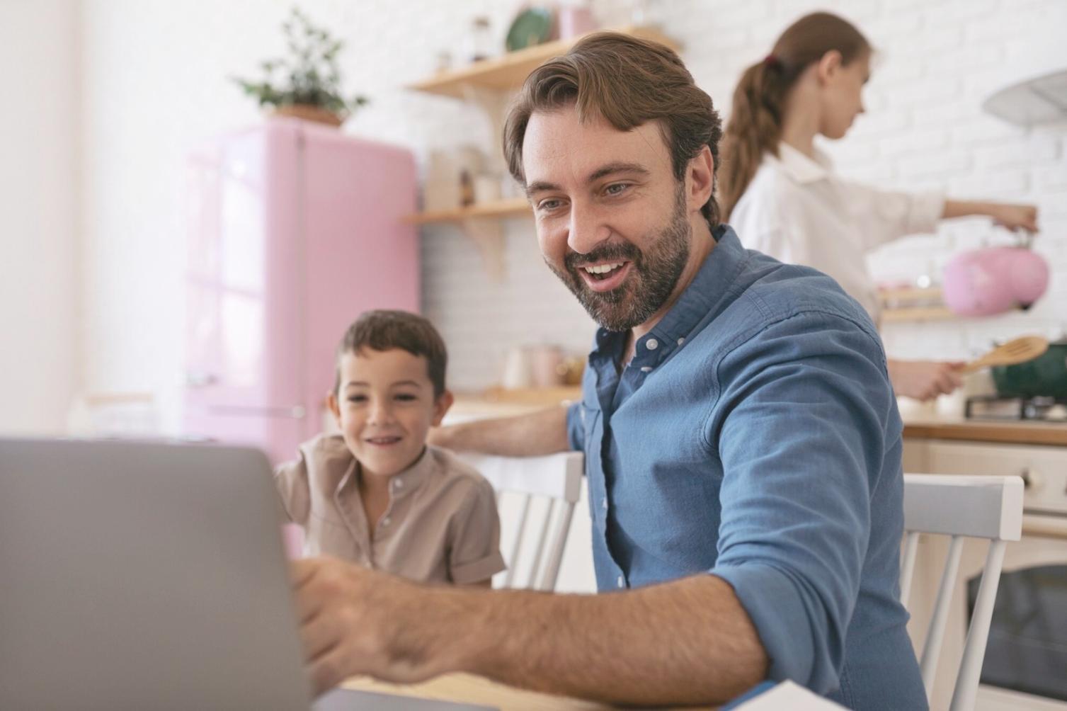 Person reviewing investment materials with laptop and notes